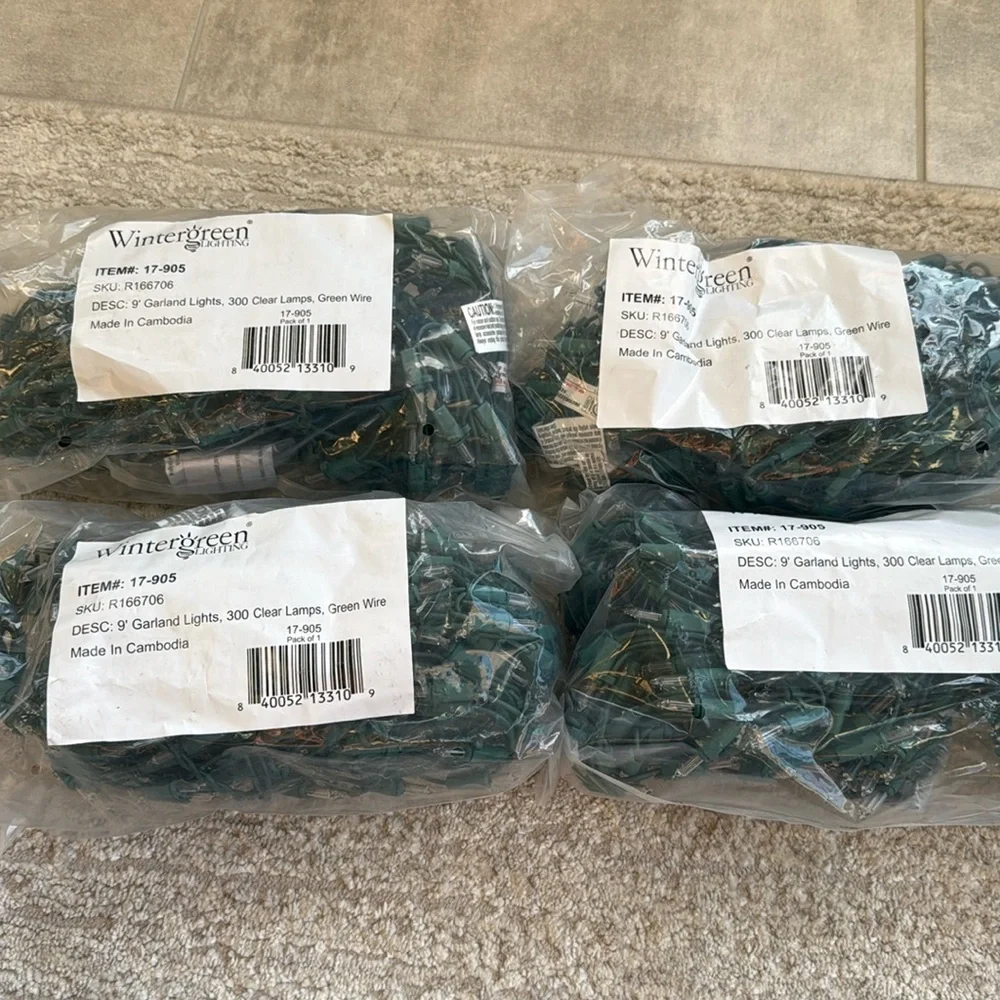 NIB-Wintergreen Lighting- 9’ Garland Lights, 300 Clear Lamps, Green Wire